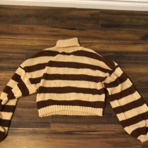 Brown turtle neck. Mid quality.